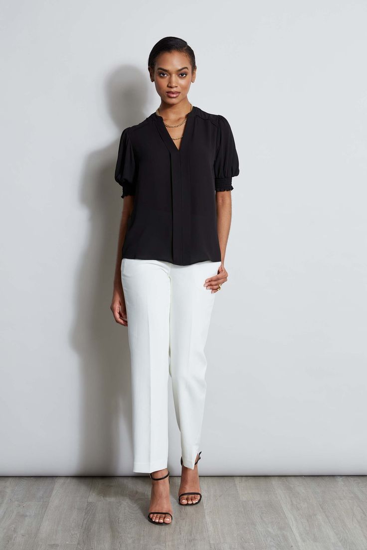 Chic & effortless, meet the perfect short sleeve top for Spring. Designed with smocking detailing & a split neckline, this luxe georgette top will take you from Spring to Fall. T-Tahari Short Smocked Sleeve V-Neck Top Runs true to size. Model is 5'9" and wearing size S Dry Clean Only Imported Style #: THF45025 Chic Short Sleeve Top For Spring Workwear, Versatile Short Sleeve Top For Spring Workwear, Chic Short Sleeve Top For Work, Elegant Black Short Sleeve Top For Spring, Smocked Sleeve, Georgette Tops, Running Tops, V Neck Tops, Short Sleeve Top