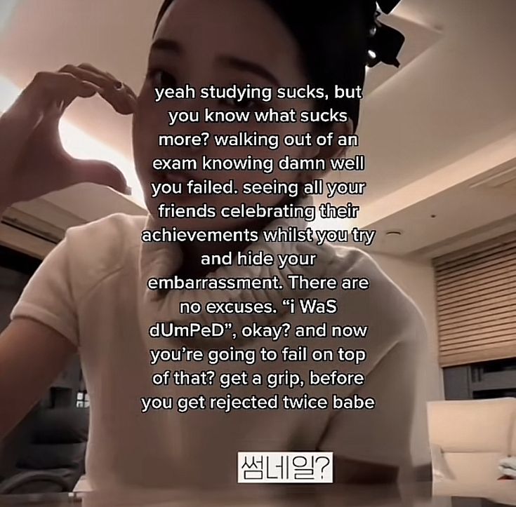 a woman is sitting at a table with her hand up to her face and the caption reads, yeah studying sucks, but you know what