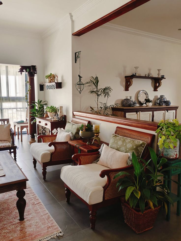 a living room filled with furniture and lots of plants