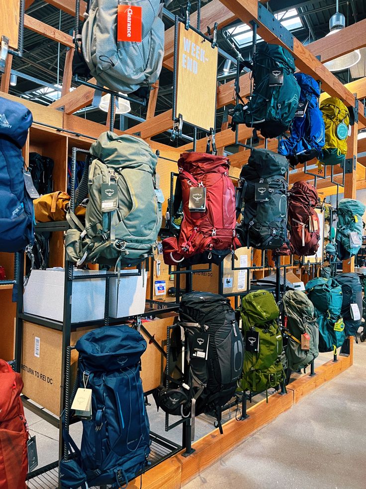 many backpacks are on display in a store