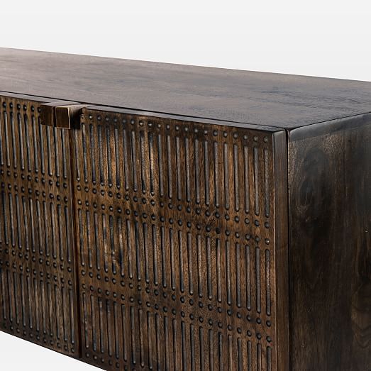 an old wooden cabinet with holes in the front and sides, on a white background