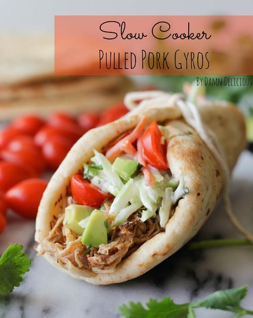 a taco filled with meat and vegetables next to some tortilla breads