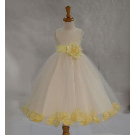 a white and yellow flower girl dress on a mannequin