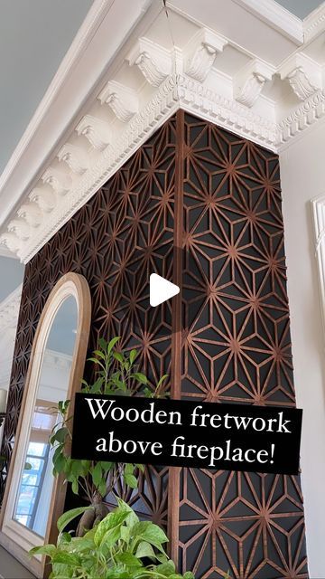 the interior of a building with woodwork above fireplaces and plants in potted planters