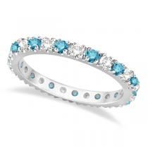 a white gold ring with blue topaz and round brilliant cut diamonds on each side