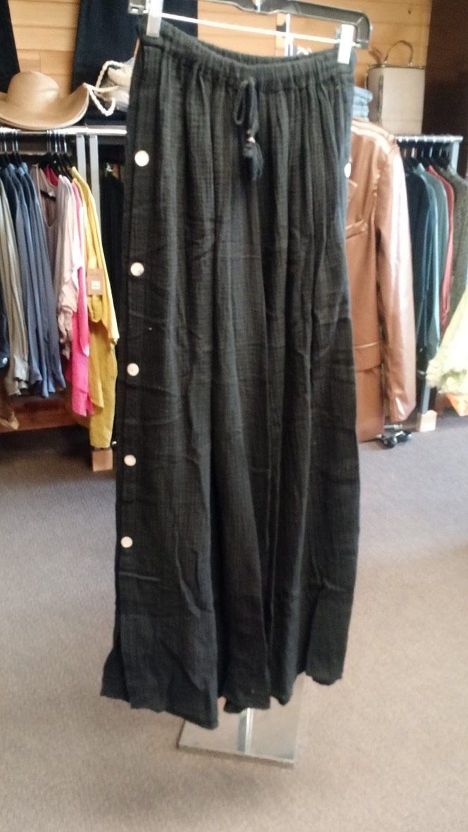 Side button-down wide-leg pants. Made in Italy. Elastic and string waistband, can be tied in the bottom for a different look. One size. Summer Loungewear Bottoms With Buttons, Button-detail Loungewear Pants, Spring Wide Leg Pants With Button Cuffs, Casual Wide Leg Bottoms With Side Buttons, Wide Leg Loungewear Pants With Button Closure, Chic Button-up Cotton Pants, Cotton Wide Leg Pants With Buttons For Spring, Wide Leg Pants With Button Closure For Spring, Spring Wide Leg Cotton Pants With Buttons