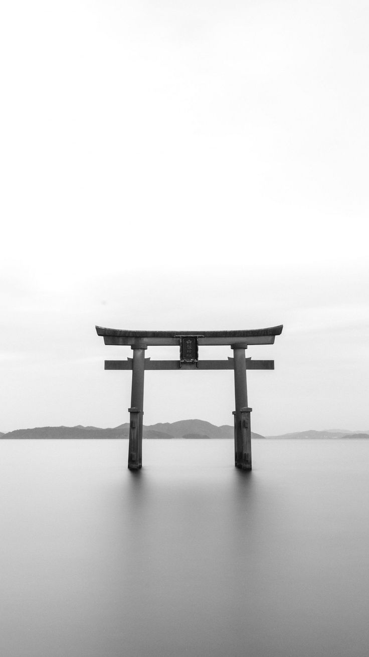 a bench sitting on top of a large body of water