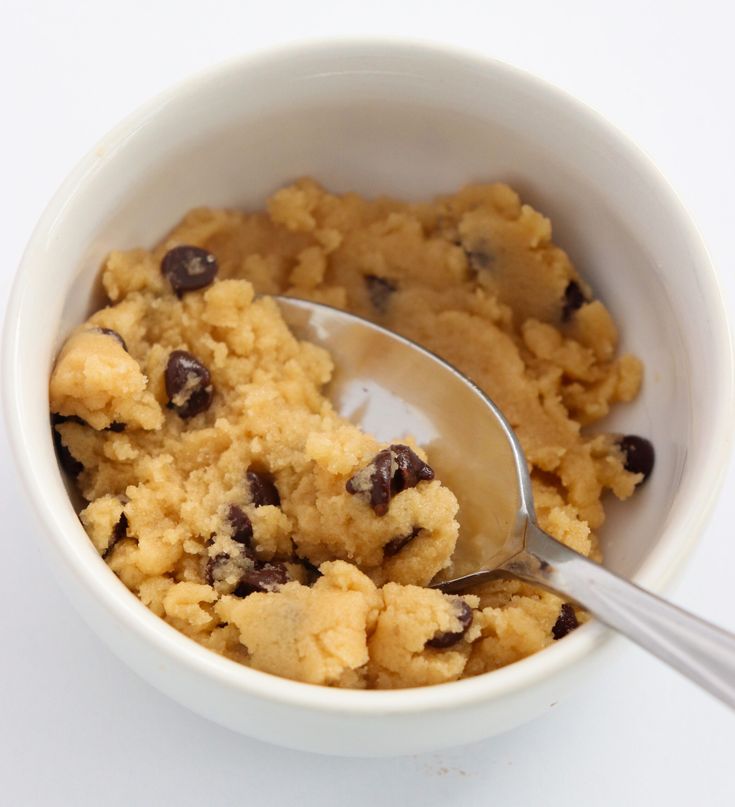 a white bowl filled with oatmeal and chocolate chips