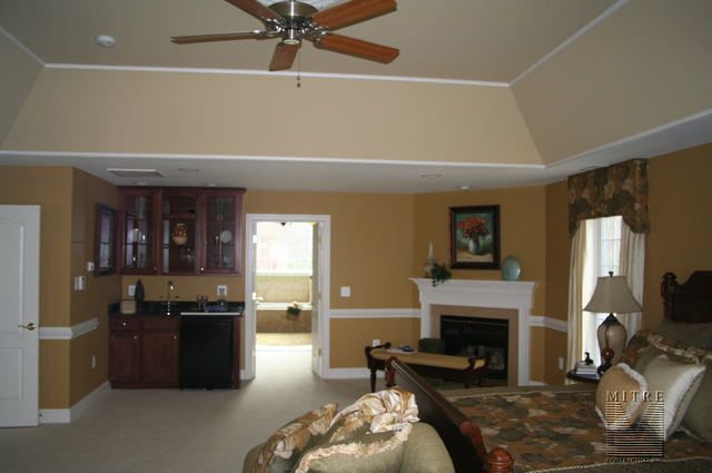 a living room filled with furniture and a fire place