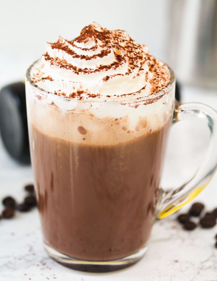 there is a hot chocolate drink with whipped cream on top