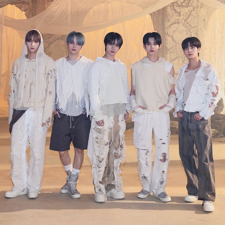 five male models standing in front of a white curtain and drapeed area with curtains behind them