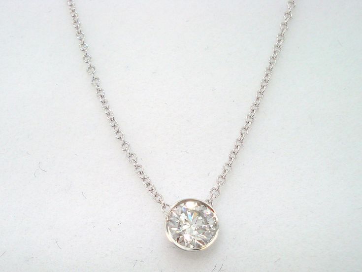 "HERE IS BEAUTIFUL DIAMOND BY THE YARD SOLITAIRE PENDANT NECKLACE 14 KARAT WHITE GOLD AVAILABLE YELLOW GOLD TOO ASK ME PLEASE...!! HANDMADE LOW BEZEL SET COMES WITH 16\" OR 18\" INCH CHAIN CENTER SHAPE- ROUND CUT- VERY GOOD CARAT- 0.35ct COLOR- G CLARITY- SI2 MEASUREMENT- 4.20mm TOTAL 0.35 CARAT BRIGHT WHITE COLOR AND CLEAN DIAMOND !! RETAIL PRICE IS OVER $2,900.00 COMES WITH $2,100.00 CERTIFIED APPRAISAL !! 100% FINE JEWELRY HAND-CRAFTED IN THE USA Why you should buy from Garo Celik Thank you f White Diamond Necklace With Bezel Setting, Classic White Necklace With Bezel Setting, White Platinum Jewelry With Bezel Setting, White Round Solitaire Necklace With Bezel Setting, White Solitaire Necklace With Bezel Setting For Wedding, White Solitaire Necklace With Bezel Setting For Formal Occasions, Formal White Solitaire Necklace With Bezel Setting, White Single Diamond Round Necklace, White Round Necklace With Single Diamond