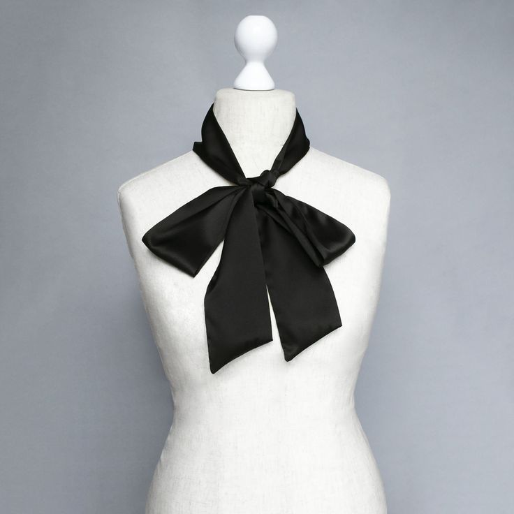 The black silk hand-made skinny scarf This black silk bow tiу adds a silky, sophisticated accent for year-round wear. The bow tie is a perfect way to accentuate simple clothes to look smart The necktie is produced from 100% silk. Sizes: Width: 8 cm / 3.14 inches Length: 177 cm / 70 inches Handmade item The product manufacturing takes 1-3 working days Please note that the color may slightly vary due to photographic lighting sources or your monitor settings. Check my other listings to see more siz Chic Black Silk Scarf Gift, Silk Scarves Perfect For Gifts, Satin Silk Scarf Gift, Formal Solid Color Satin Scarves, Elegant Silk Scarves With Satin Finish, Chic Black Scarf For Gift, Elegant Scarves With Ribbon For Gift, Black Silk Scarves As A Gift, Black Silk Scarf For Party