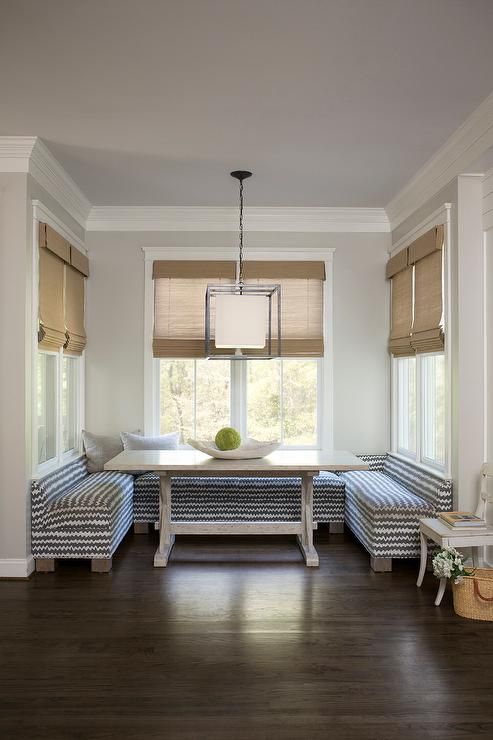 a dining room with two benches and a table