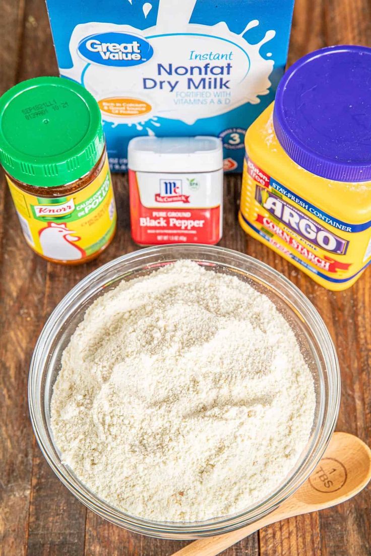 ingredients to make cake sitting on top of a wooden table