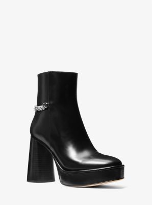 The Carlisle platform boot balances ’70s flair with modern polish. Designed to sit slightly above the ankle, this leather pair features a 4.25” stacked heel that’s balanced by a 1.25” front platform for soaring height with ease of wear. Keep the high-shine hardware in focus with mini hemlines. Modern Leather Heeled Boots With Chunky Platform, High Ankle Platform Boots For Formal Occasions, Bold Leather Platform Boots For Fall, Formal Leather Platform Boots With Chunky Platform, Bold Leather Ankle Heeled Boots, Bold Leather Ankle Boots, Formal High Ankle Boots With Chunky Platform, Bold Leather Platform Boots With Round Toe, Bold Leather Heeled Boots For Fall