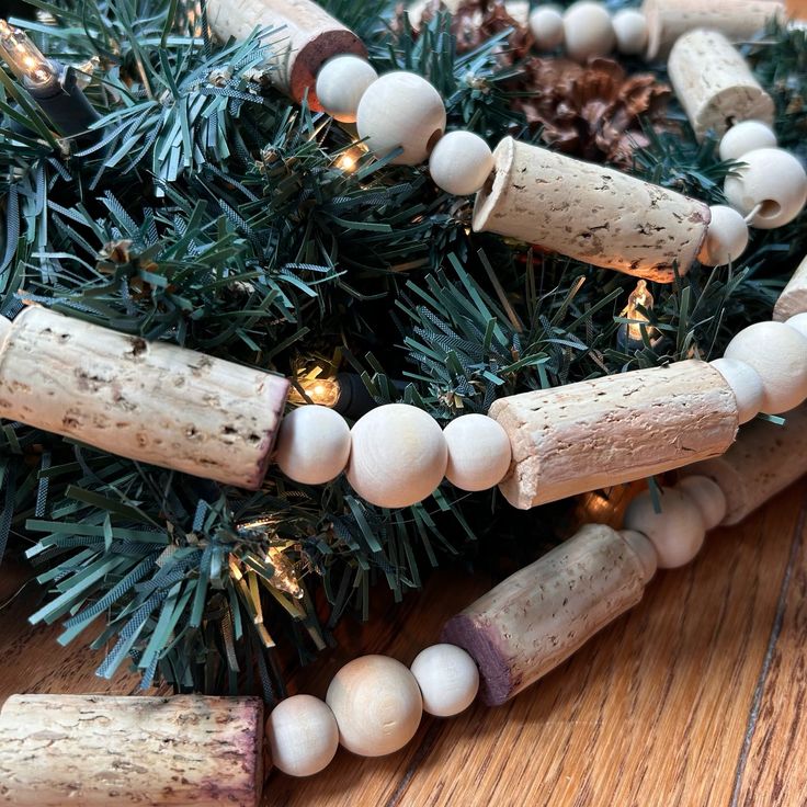 a bunch of wine corks sitting on top of a table next to a christmas tree