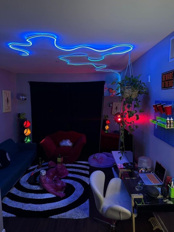 a living room filled with lots of furniture and neon lights on the ceiling above it