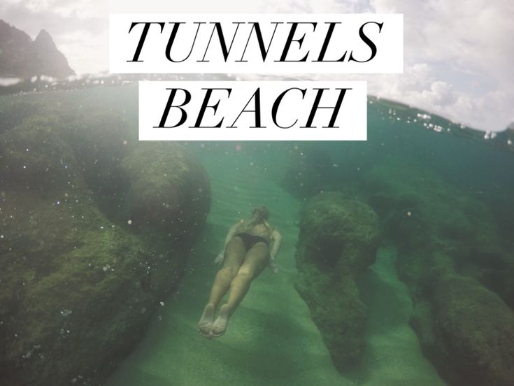 a woman swimming in the ocean with text reading tunnels beach