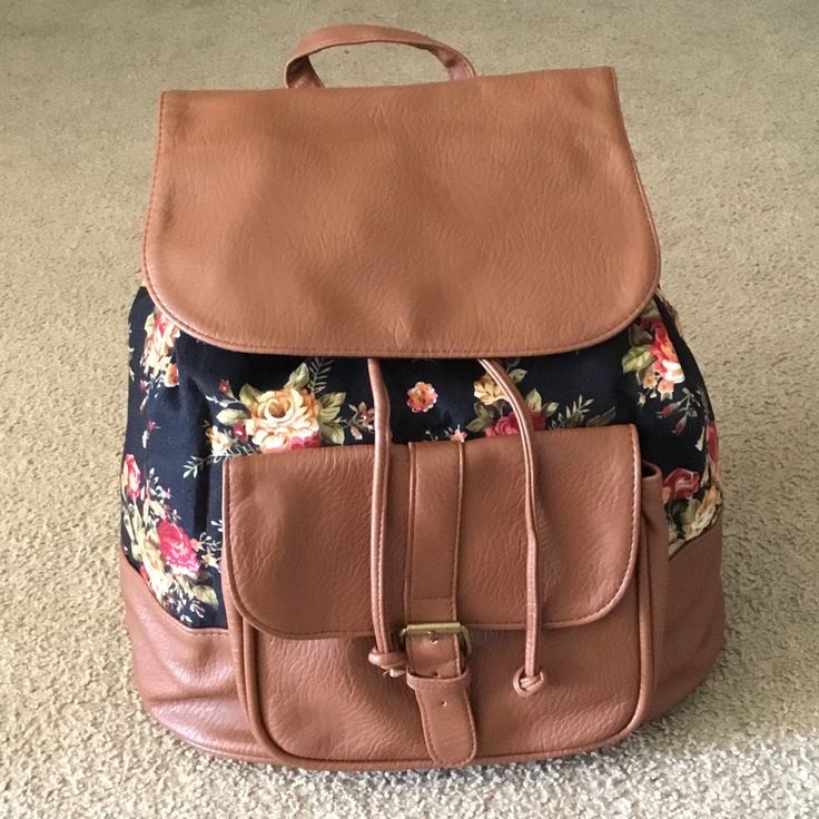 New Black Floral Canvas And Brown Faux Leather Backpack. Features A Front Flap Closure With Adjustable Drawstring And Snap Button, Front Button Snap Pocket, Adjustable Shoulder Straps, Top Handle And One Zipper Pocket Inside Brand: Charlotte Russe Size: 14”In X 13”In Casual Faux Leather Backpack For School, Casual Faux Leather School Backpack, Brown Faux Leather Backpack For On-the-go, Casual Faux Leather Satchel Backpack, Casual Brown Satchel With Leather Backing, Casual Faux Leather Backpack With Adjustable Strap, Casual Brown Faux Leather Backpack, Brown Casual Satchel With Snap Closure, Casual Brown Satchel With Snap Closure