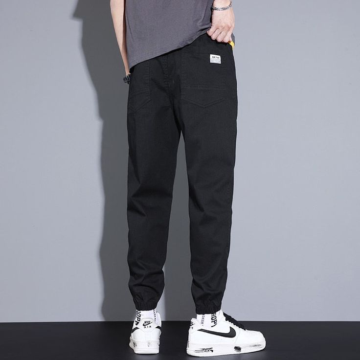 Vinny Loose Pants are a pair of men's relaxed fit jogging pants that can pair with a streetwear or workout outfit. Featuring a relaxed fit, these joggers offer maximum comfort for men who want to feel comfortable all day long. Available in the following variants: Black, Blue, Grey Material: Cotton & Polyster Style: Casual / Smart Casual Season: all seasons Gender: MEN Feature: Breathable/Comfortable, Stretched Size chart in CM Size chart in INCH Urban Baggy Joggers For Streetwear, Baggy Tapered Leg Joggers With Elastic Waistband, Casual Straight Parachute Pants For Streetwear, Straight Leg Cotton Jogging Bottoms, Relaxed Fit Joggers For Streetwear, Straight Leg Cotton Bottoms For Jogging, Casual Straight Leg Parachute Pants For Streetwear, Cotton Tapered Leg Sweatpants For Streetwear, Cotton Straight-leg Jogging Bottoms