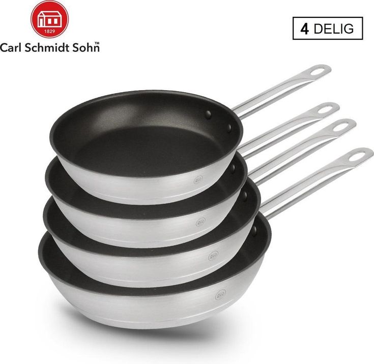 four black and white pans stacked on top of each other in front of a white background