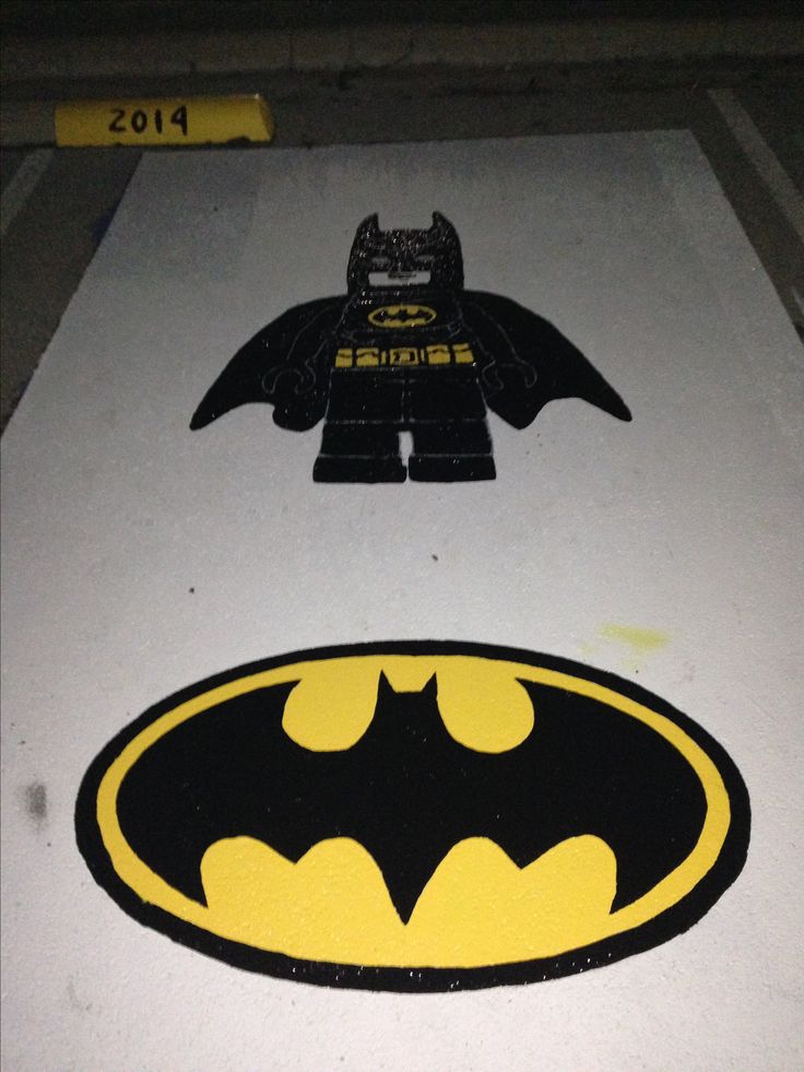 two lego batman logos are shown on the floor