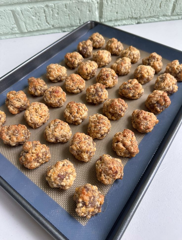 a baking tray filled with muffins on top of a table