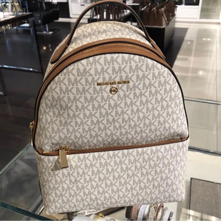 100% Authentic Michael Kors Women Valerie Medium Logo Backpack 9.25"W X 12.5"H X 3.75"D White Leather Backpack With Dust Bag, White Luxury Backpack With Removable Pouch, Luxury White Backpack With Removable Pouch, Luxury White Backpack For Errands, Michael Kors White Travel Backpack, Michael Kors White Backpack For Daily Use, Michael Kors White Standard Backpack, White Michael Kors Backpack For Everyday, Luxury Michael Kors White Backpack