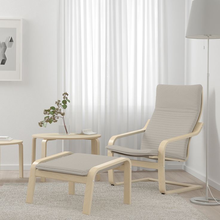 a white living room with two chairs and a coffee table