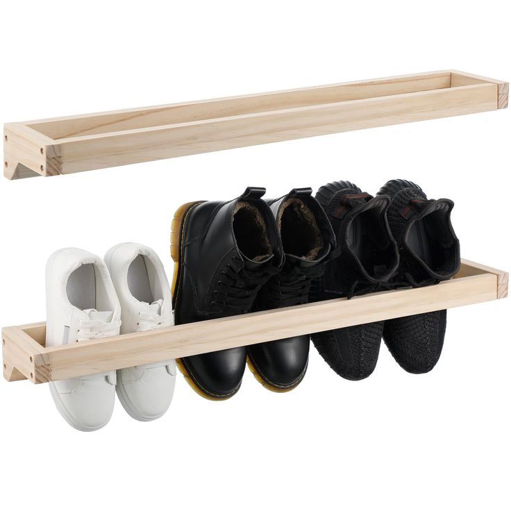 two wooden shelves holding pairs of shoes