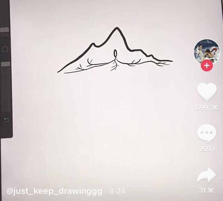 an image of a mountain drawn on the side of a computer screen