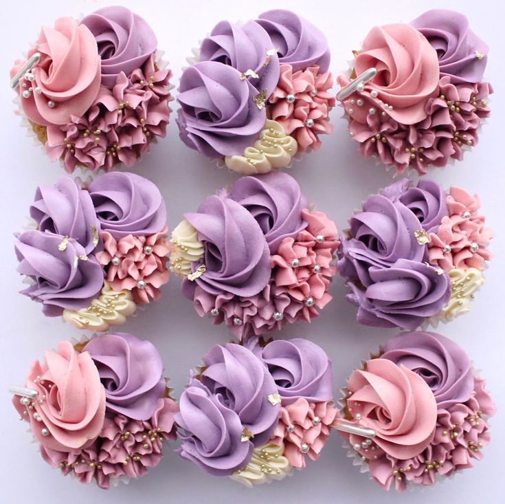 cupcakes decorated with pink and purple frosting