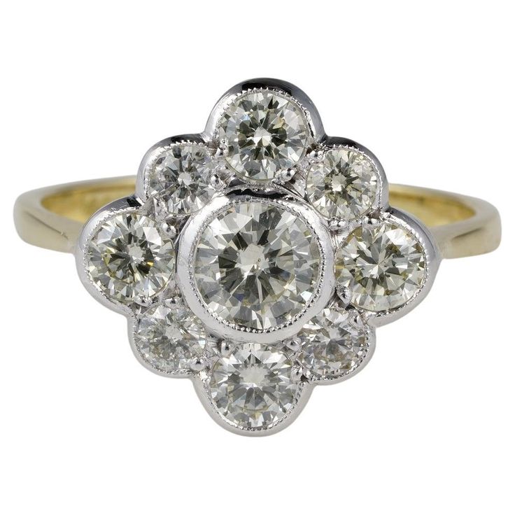 A Burst of Diamonds Very charming old cluster ring boasts fine hand crafting in combination with high degree old transitional Brilliant cut Diamonds Low profile for the crown which is Platinum made backed with 18 KT gold -stamped Perfect engagement ring designed in the Edwardian style Centre Diamond is .60 Ct or slightly larger, rated as H/ I colour SI clarity; with a surrounding made by 1.0 full Carat of Diamonds H/I VVS/VS all old transitional Brilliant cut Diamonds full of the allure of Natur Platinum Diamond Engagement Rings, Edwardian Style, Cluster Engagement Ring, Art Deco Engagement, Platinum Engagement Rings, Deco Engagement Ring, Edwardian Fashion, Art Deco Engagement Ring, Antique Diamond