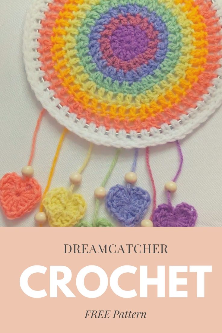 the crochet dream catcher is made with yarn and beads