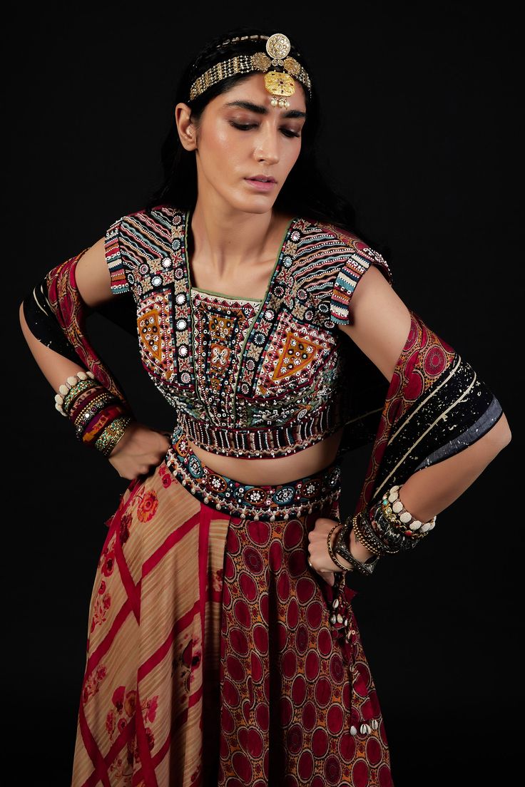 Multi color blouse, featuring exquisite resham thread embroidery, mirror and beads with multiple prints.
Component: 1
Embroidered, Printed
Neckline: Square
Sleeve Length: Cap
Fabric: Cotton 
Color: Multi Color
Deep back neck with tassel tie-ups
Note: The trouser and dupatta worn by the model is not for sale - Aza Fashions Asymmetric Pants, Statement Crop Top, Embroidery Square, Saree Blouses Online, Red Kurta, Kurta Cotton, Multi Color Blouse, Flowy Pants, Blouse Online