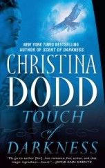 the cover of touch and darkness by christiana dodd, with an eagle flying above it