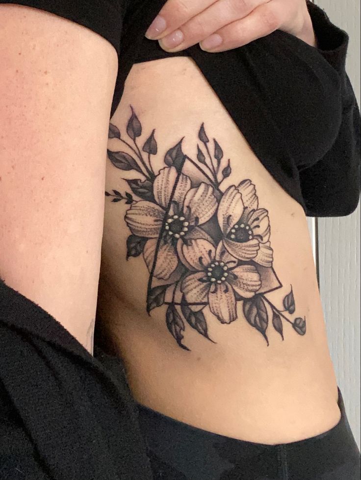 a woman's stomach with flowers on it