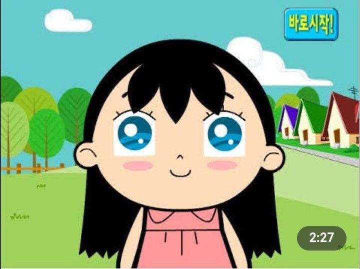 an animated girl with blue eyes standing in front of a green field and some houses