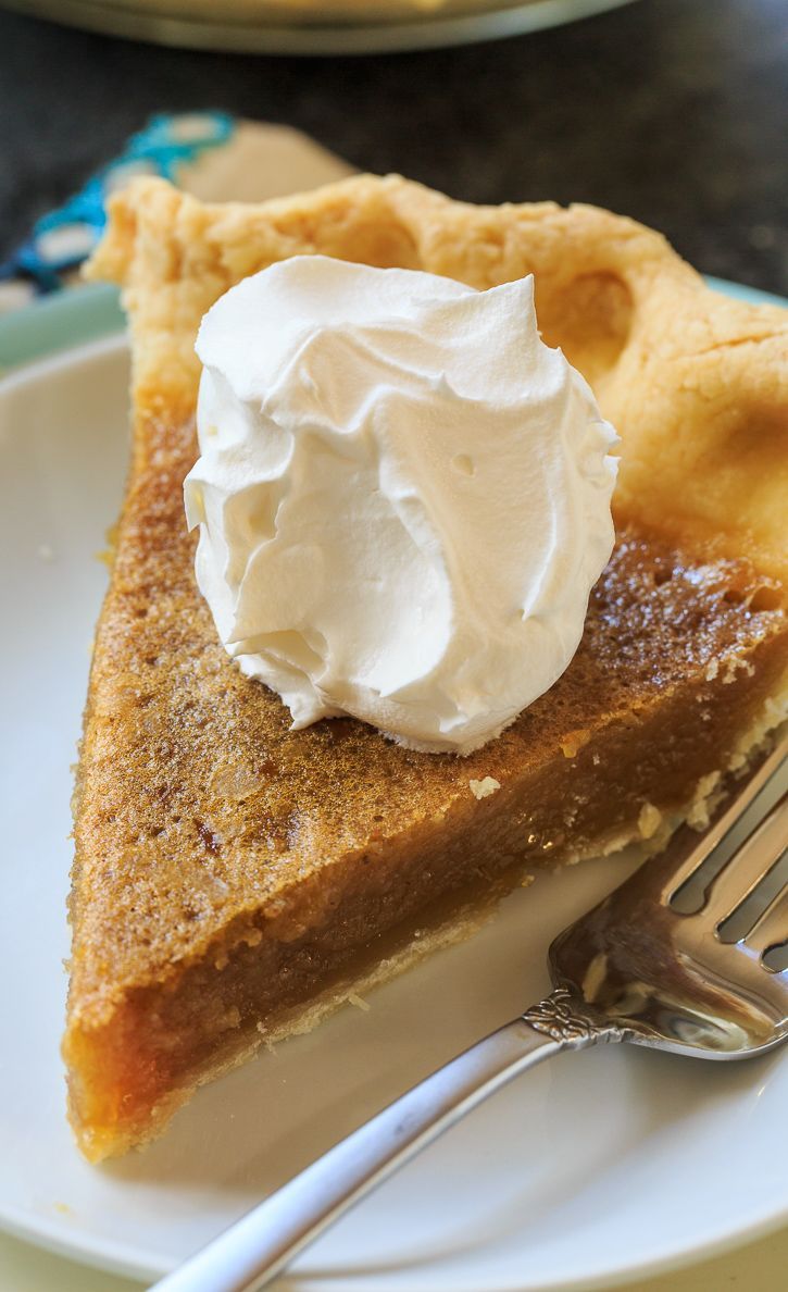 a slice of pie with whipped cream on top