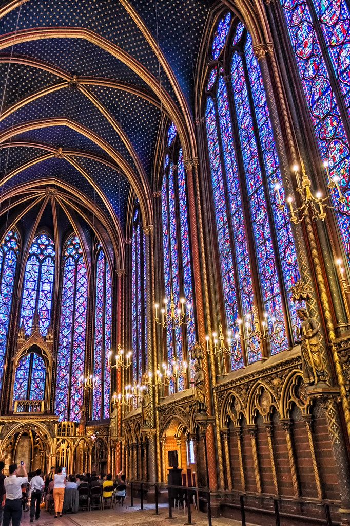 the inside of a large cathedral with stained glass windows