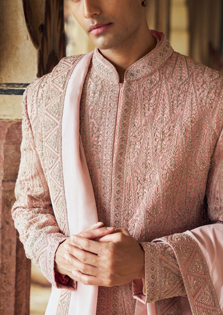 Exude elegance in this dusty rose pink raw silk sherwani, intricately embroidered with tonal dori work and highlighted with beads and crystals. It pairs beautifully with an ivory monga tussar kurta and churidar. Enhance your ensemble with a worked belt and stole. Luxury Pink Sherwani With Dupatta, Indian Wedding Wear, Churidar, Wedding Wear, Pink Fabric, Raw Silk, Dusty Rose, Indian Fashion, Indian Wedding