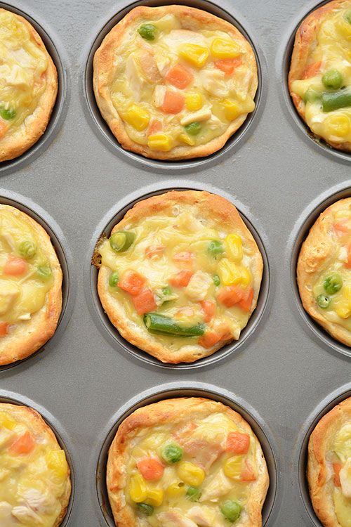 twelve muffin tins filled with different types of food