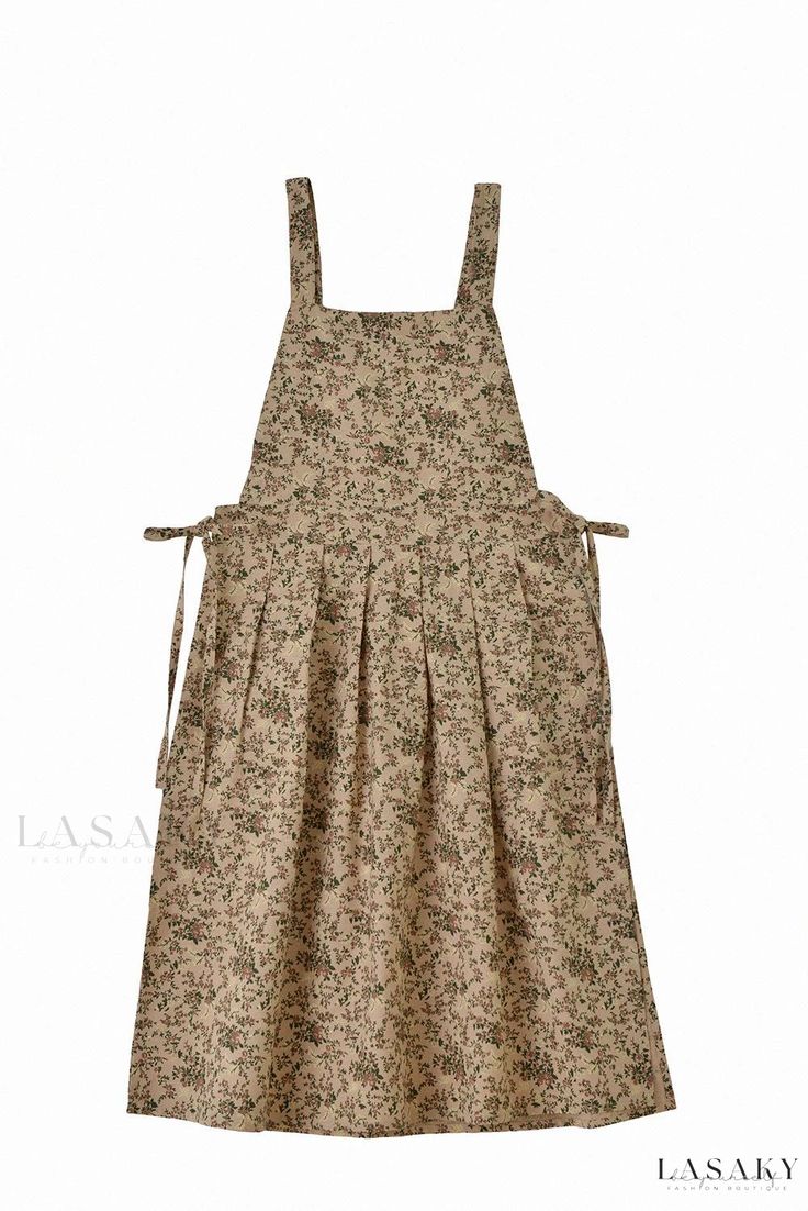 a dress that is made out of fabric and has straps on the front, with an attached