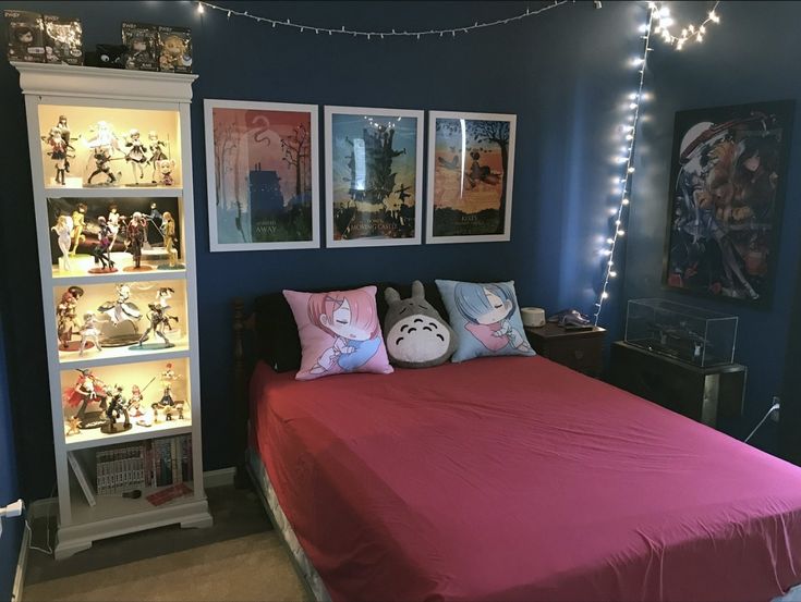 a bedroom with blue walls and pink bedspread, lights strung from the ceiling