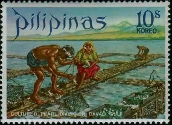 a stamp with an image of two people on a dock