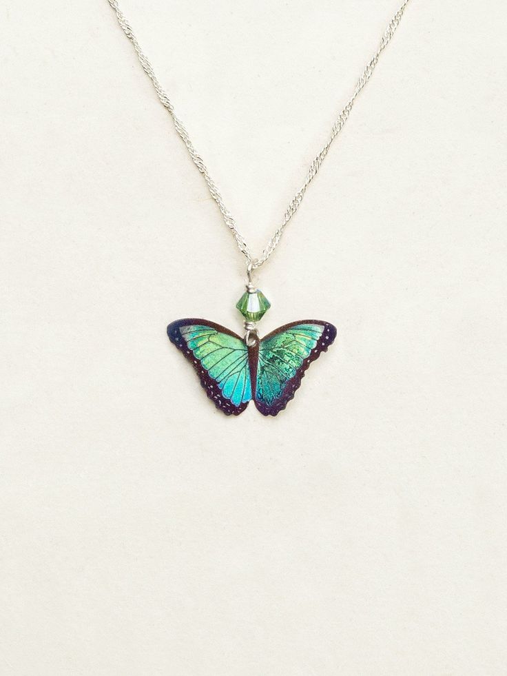 Green Flash Bella Butterfly Pendant Necklace Holly Yashi Necklace, Iridescent Fusion Style Gemstone Jewelry, Iridescent Fusion Style Jewelry With Gemstone, Iridescent Fusion Gemstone Jewelry, Artisan Green Jewelry For Festival, Silver Butterfly Nature-inspired Jewelry, Artistic Blue Jewelry For Festivals, Green Sterling Silver Necklace For Her, Iridescent Sterling Silver Spiritual Jewelry