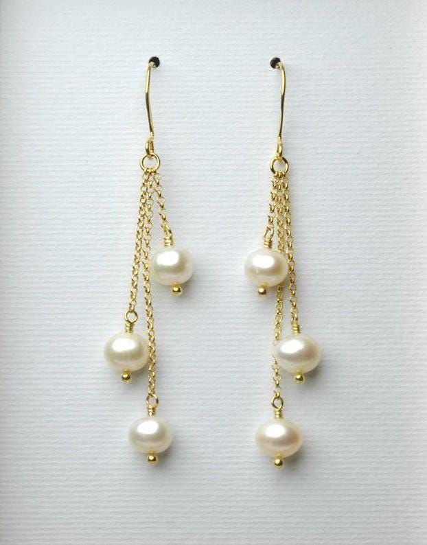 A gorgeous and classy pair of pearl earrings with high quality freshwater pearls that will be great for your wedding day, as a gift for your bridesmaids or any special woman in your life! They look perfect with every colour and outfit! - Total length of the earrings: ~ 2.5 inches (6.5 cm)  - You can choose between solid sterling silver or 24k gold plated sterling silver. - All earrings are sent to you with silicon backs. PEARL PROPERTIES: * Offer optimism, vitality, wellness, health, longevity a Pearl Properties, Pearl Dangle Earrings Wedding, Bridal Pearl Jewelry, Classic Pearl Jewelry, Real Pearl Earrings, Beaded Jewelry Earrings, Pearl Jewelry Gift, Long Pearl Earrings, Dangle Earrings Wedding