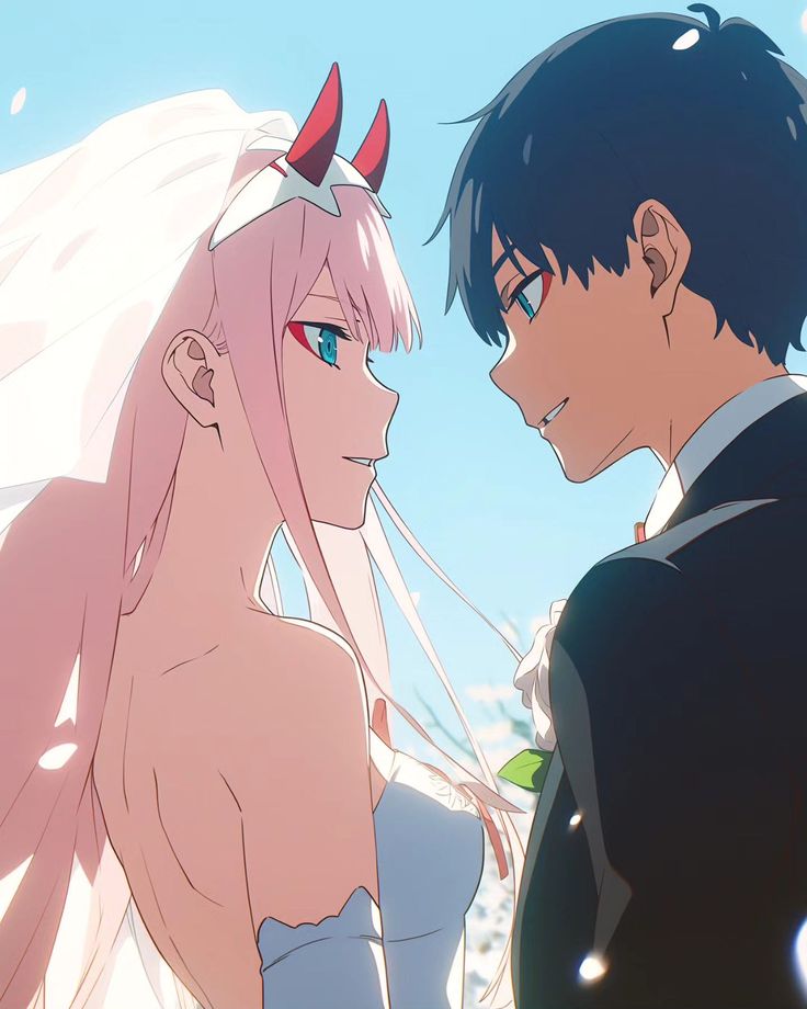 two anime characters standing next to each other with horns on their heads and hair blowing in the wind