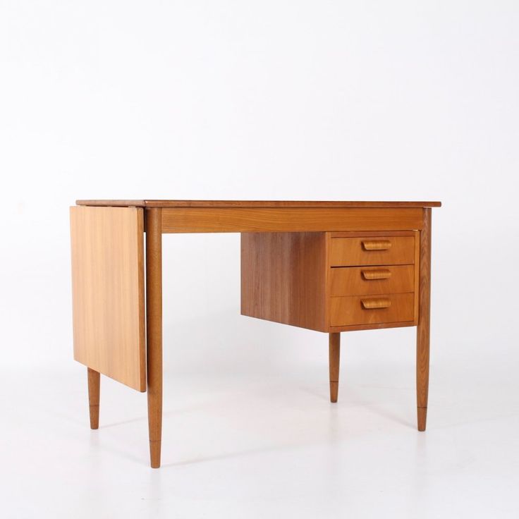 a wooden desk with two drawers on one side and an open drawer on the other